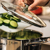 Boiling vegetables in a pot with a lid